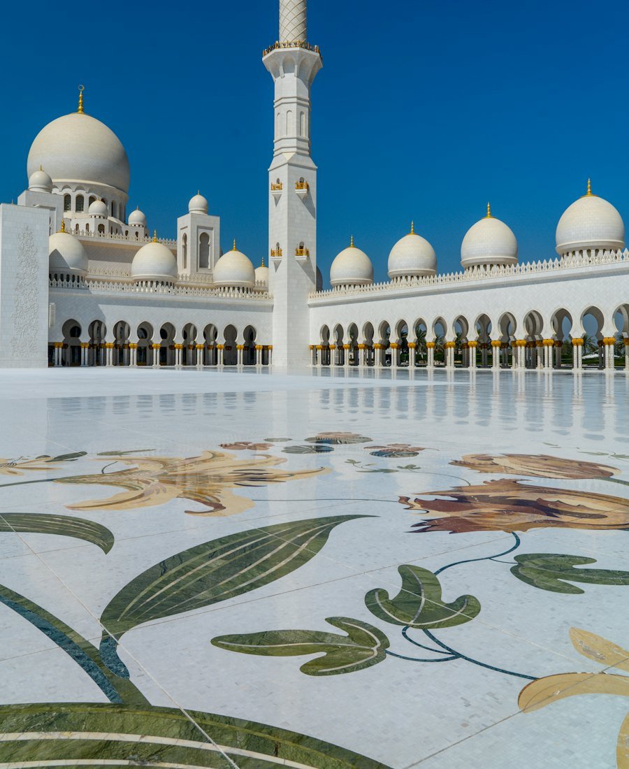White domes and marble courtyard of the Sheikh Zayed Grand Mosque, Abu Dhabi